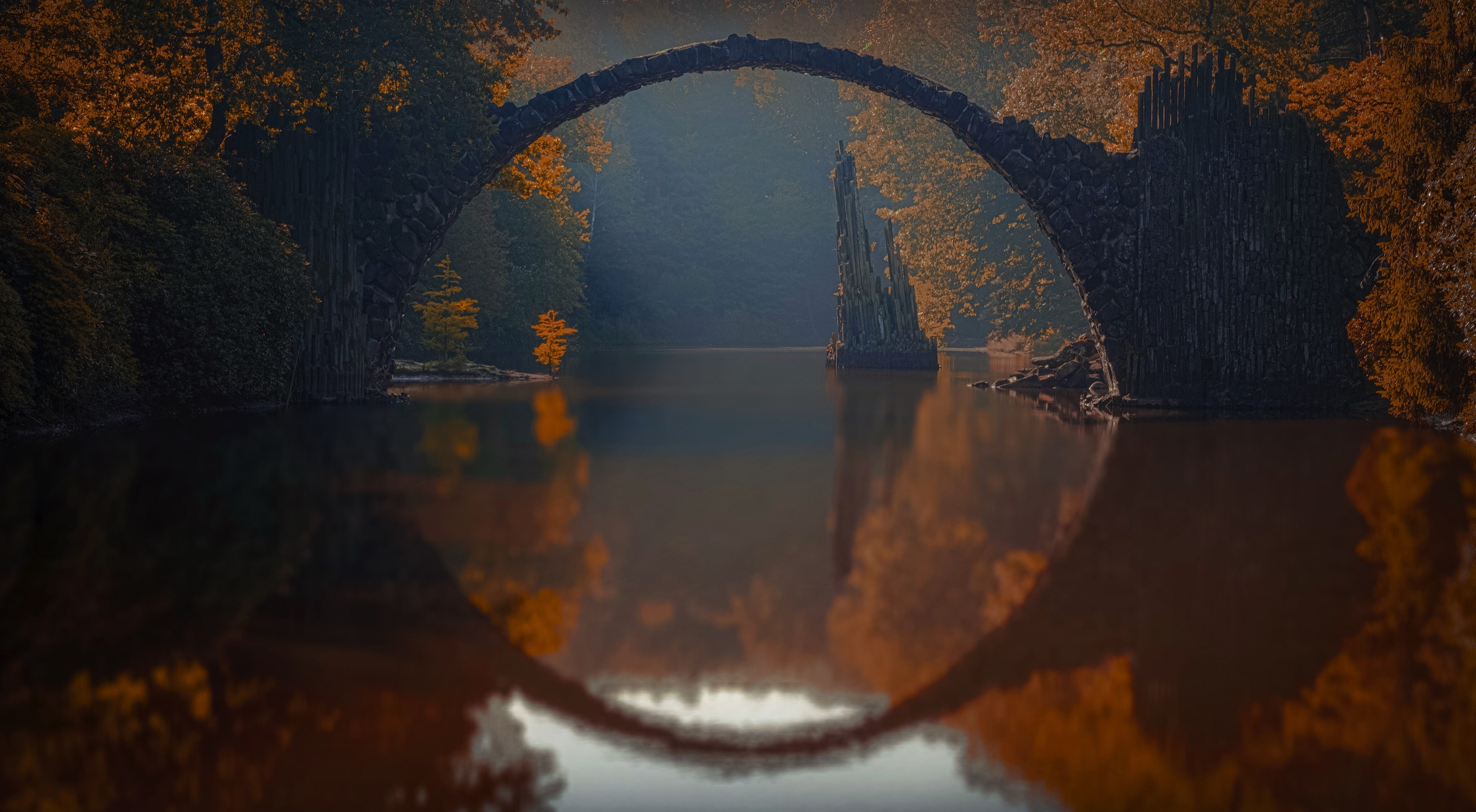 arch reflected in water